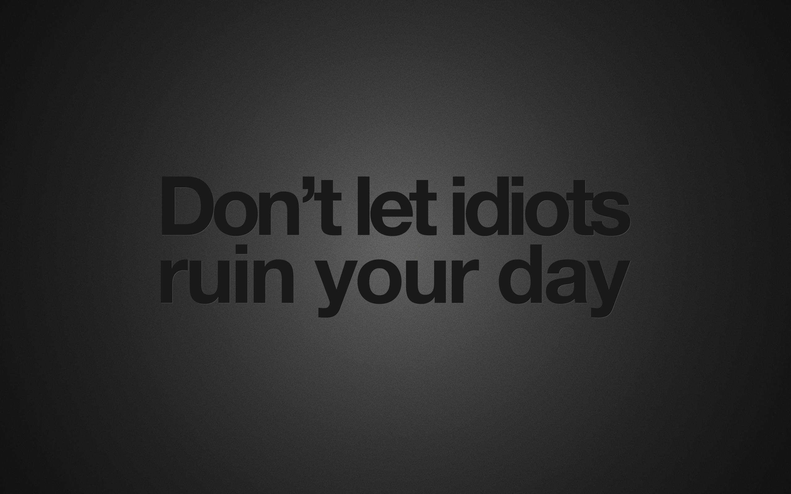 Motivational wallpaper with a dark gray background and the phrase 'Don't let idiots ruin your day' in bold black text