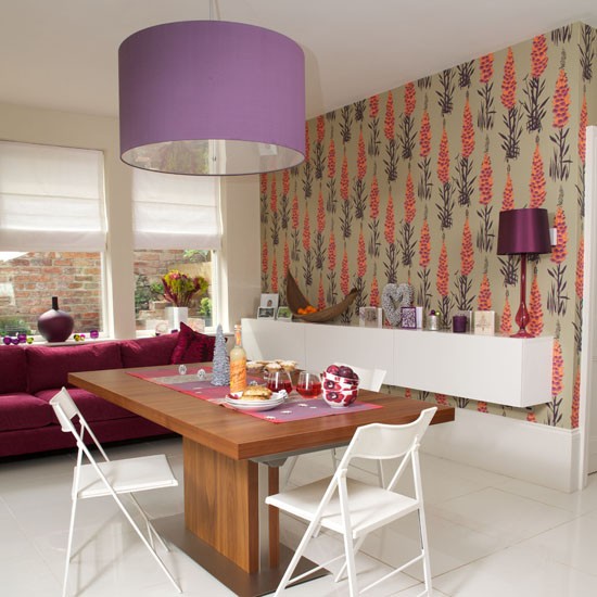 Bold Printed Wallpaper Feature Wall Sofa Shelf Table Chairs And
