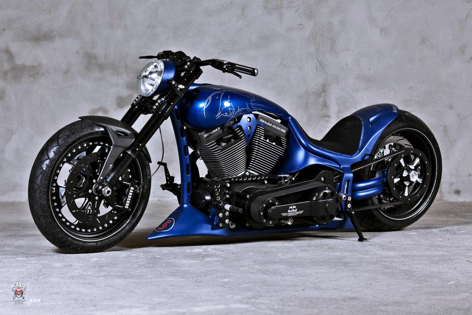 Custom Blue Harley Davidson Motorcycle against a Grey Wall