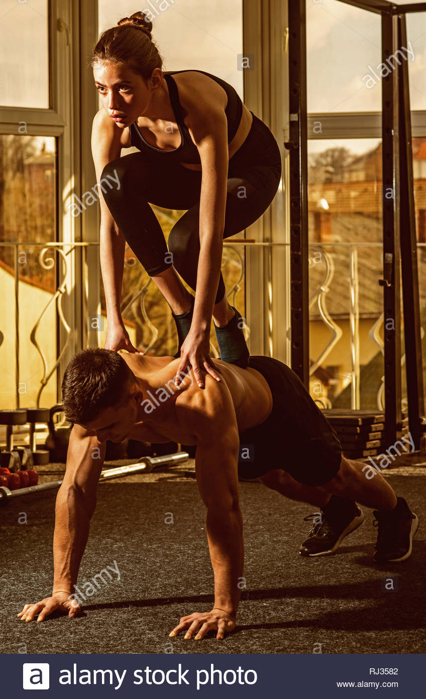 Man And Woman In Sportswear Gym Window On Background Couple
