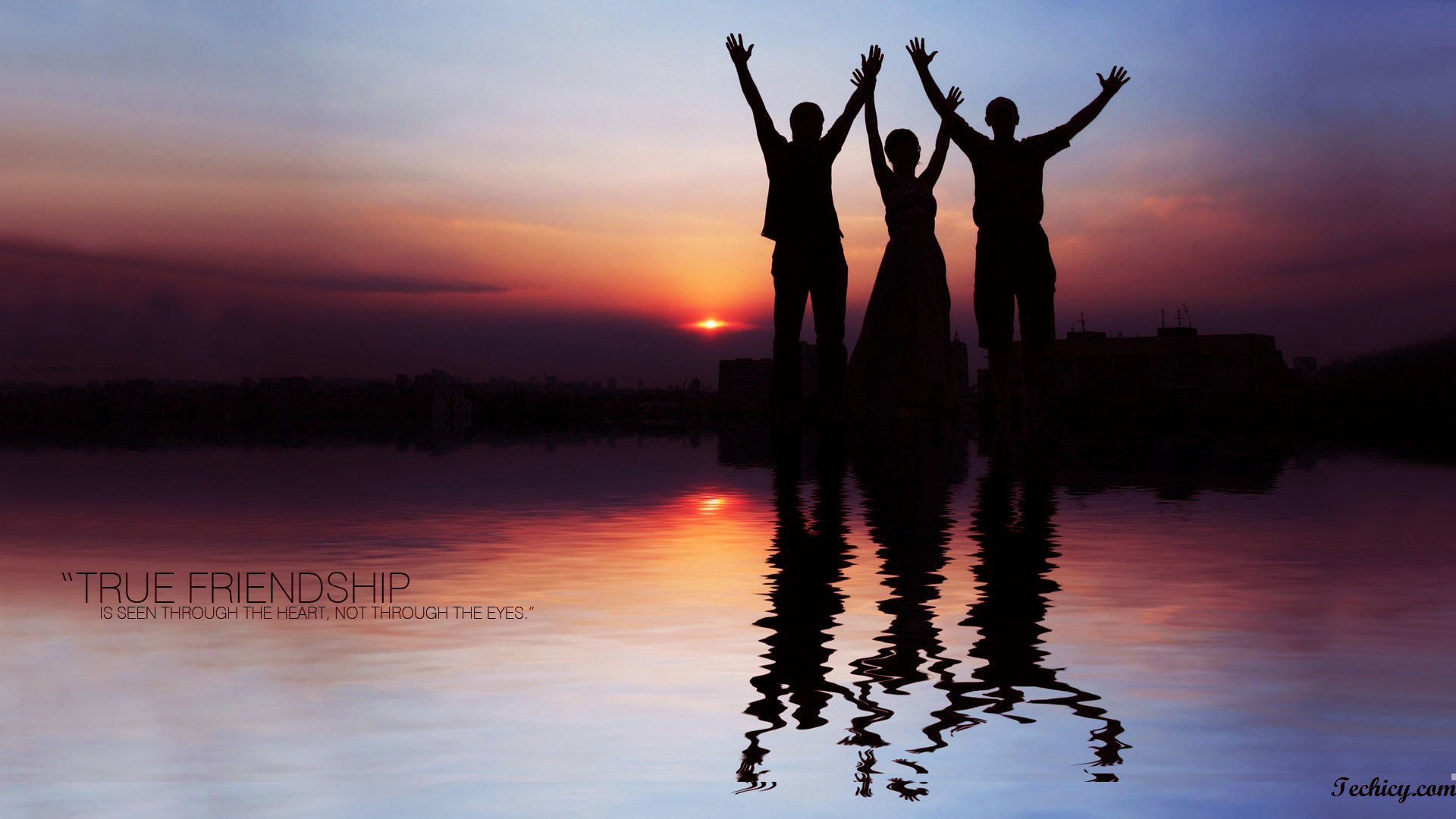 Silhouette of three friends with raised arms at sunset reflecting in water, symbolizing true friendship