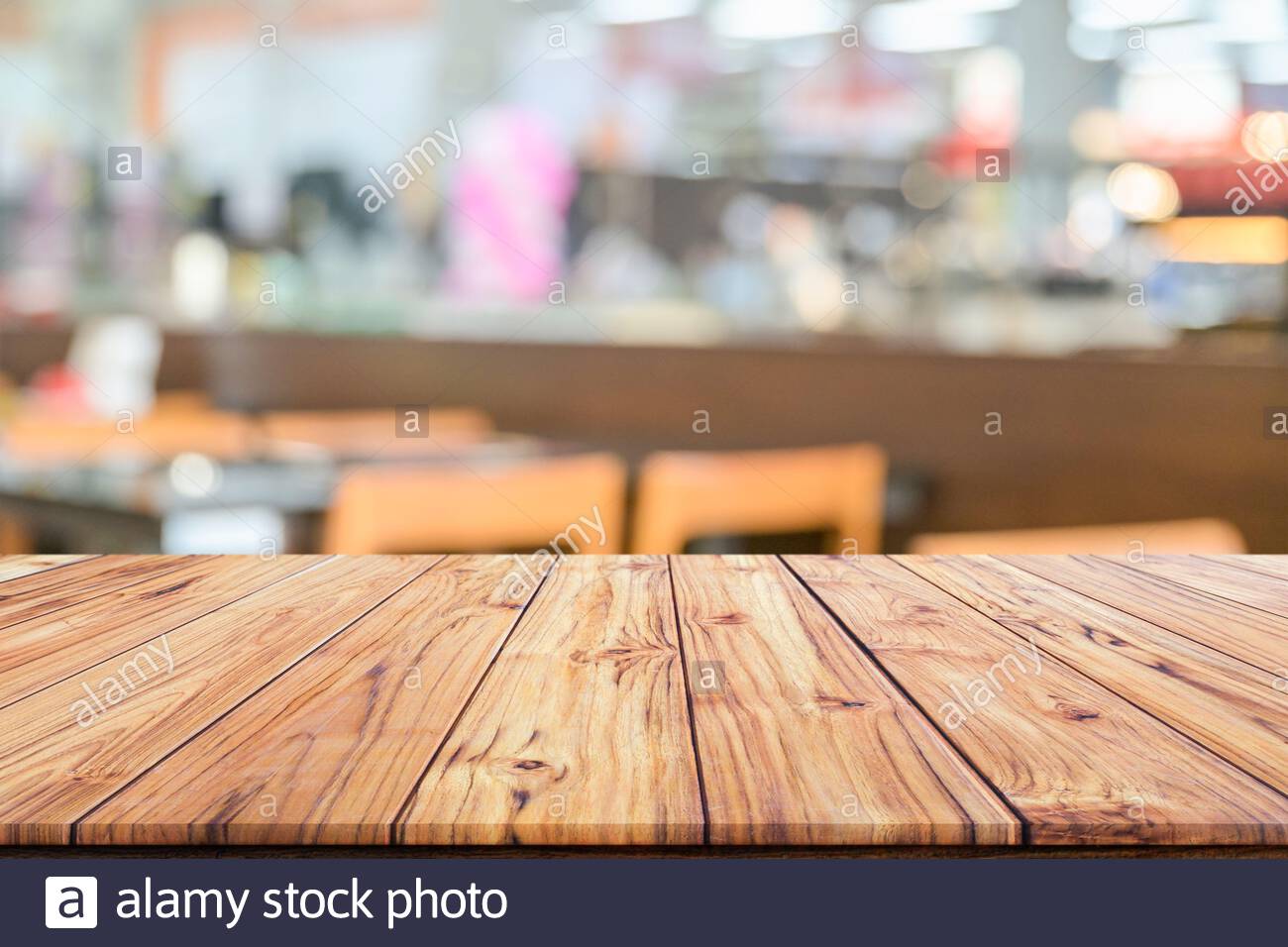 Wooden Table Top On Blurred Background Of Interior Coffee Shop Or