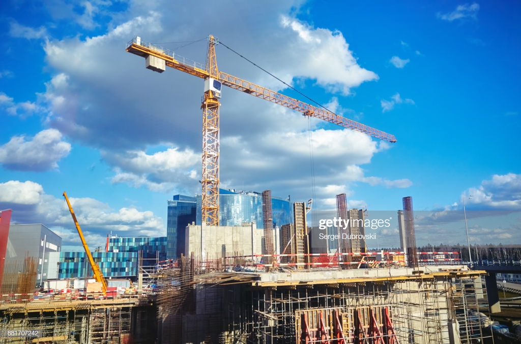 Construction Site Crane At Blue Sky Background High Res Stock