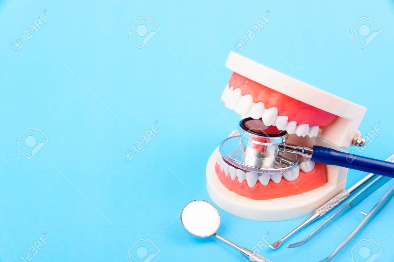 Dental Hygiene Health Concept White Tooth And Dentist Tools For