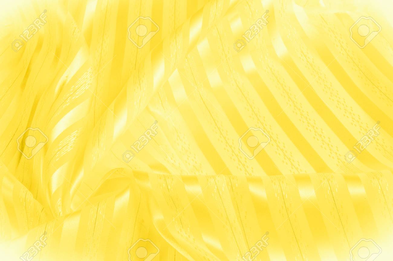 Background Texture Pattern Yellow Silk Fabric With A Light