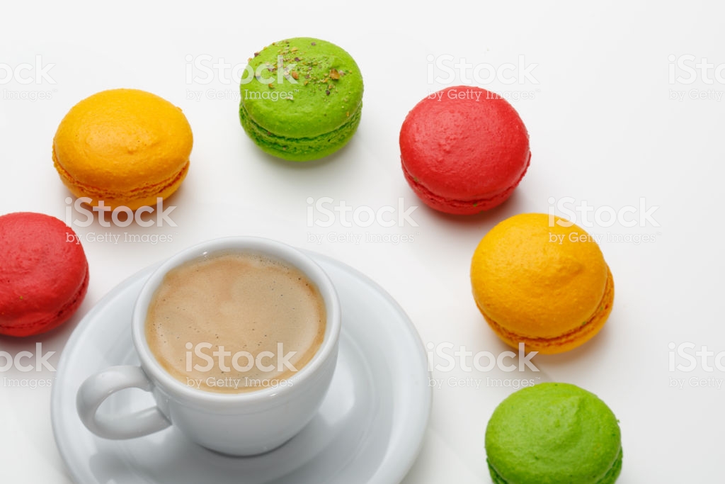 Macarons And A Cup Of Expresso On White Background Conceptual