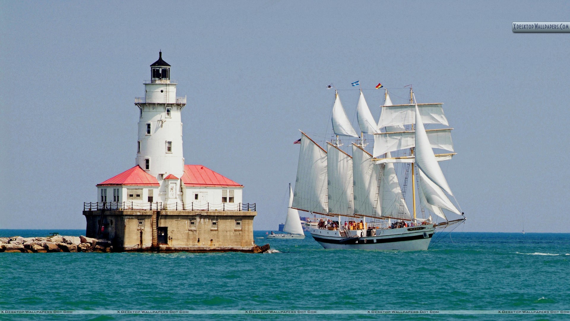 Tall Ship Windy Sails Past The Chicago Harbour Lighthouse