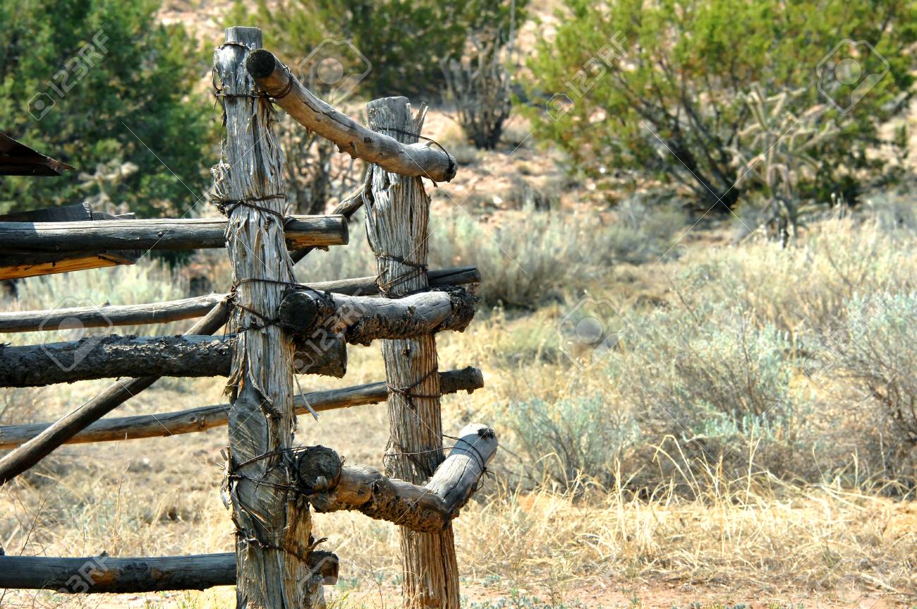Background Image Shows Old Corral With Bark Edged Wooden Posts