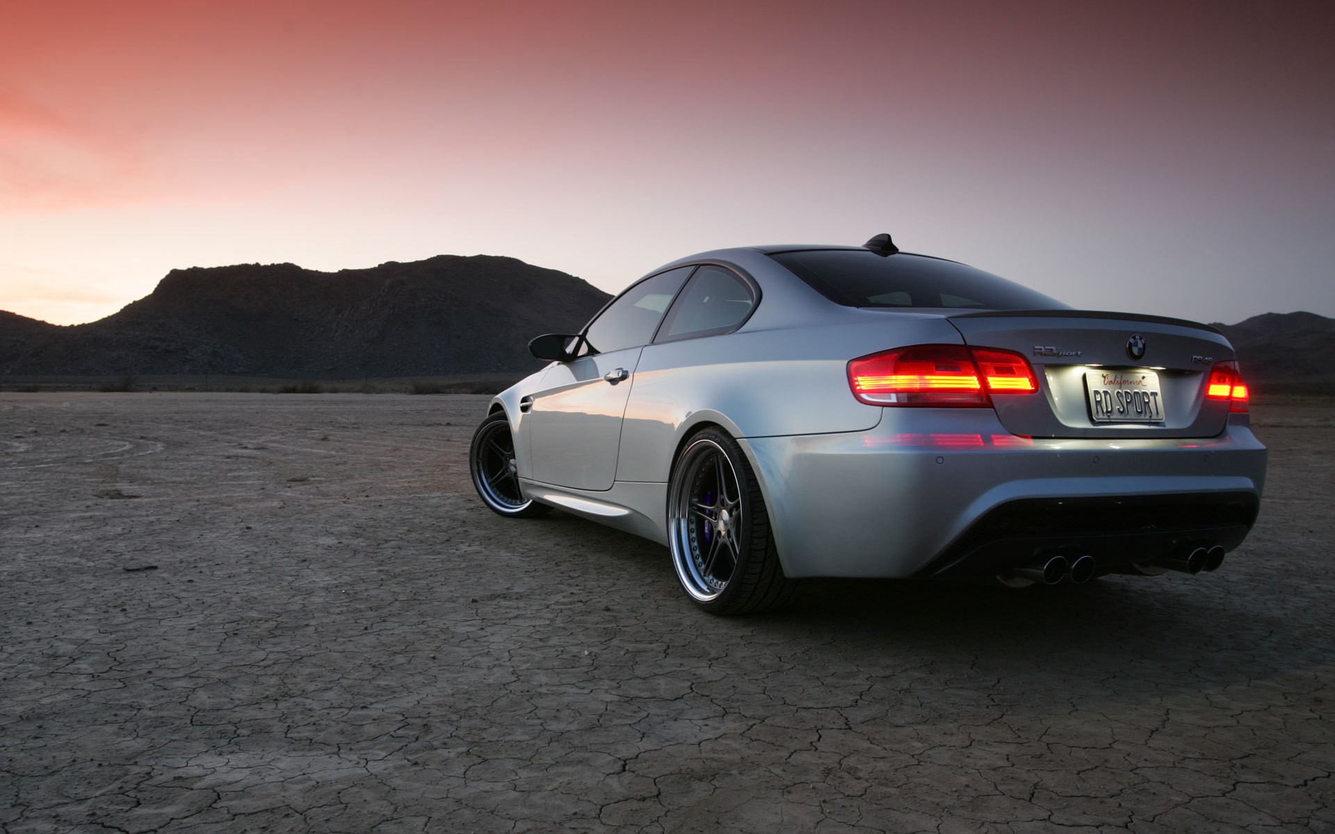 Silver BMW M3 Coupe Parked in Desert at Sunset