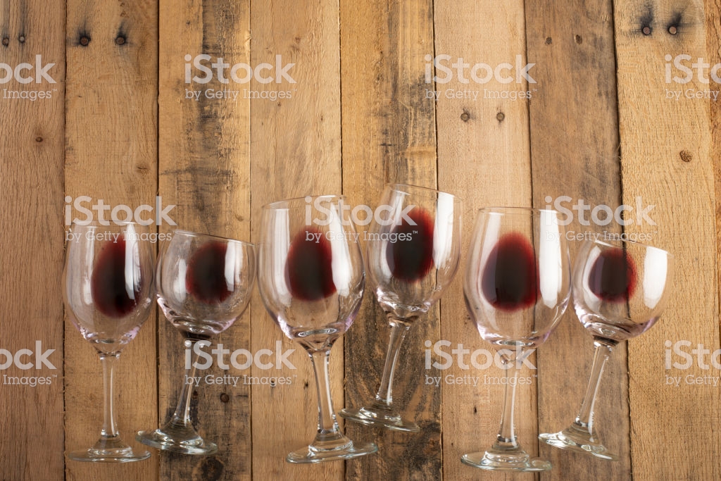 Red Wine In Transparent Glasses On A Wooden Background Bojole