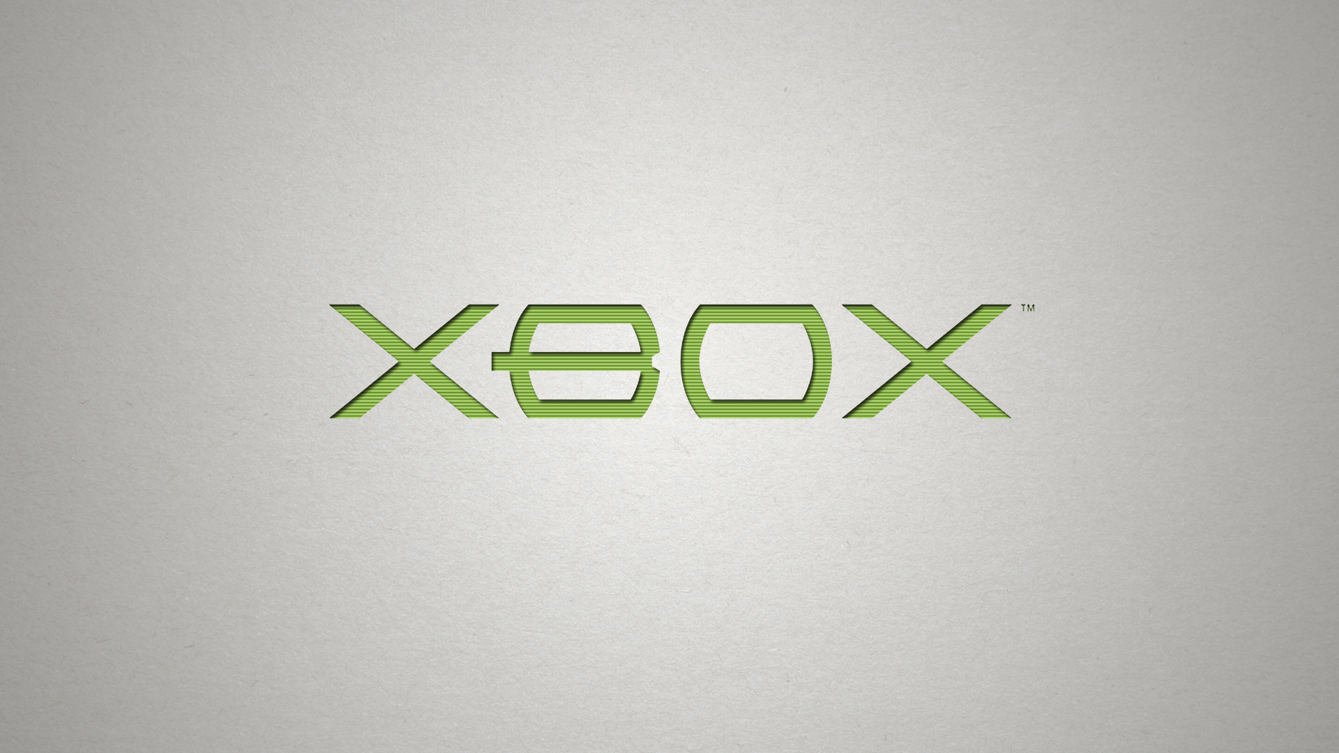 A minimalist Xbox logo embossed on a textured gray background