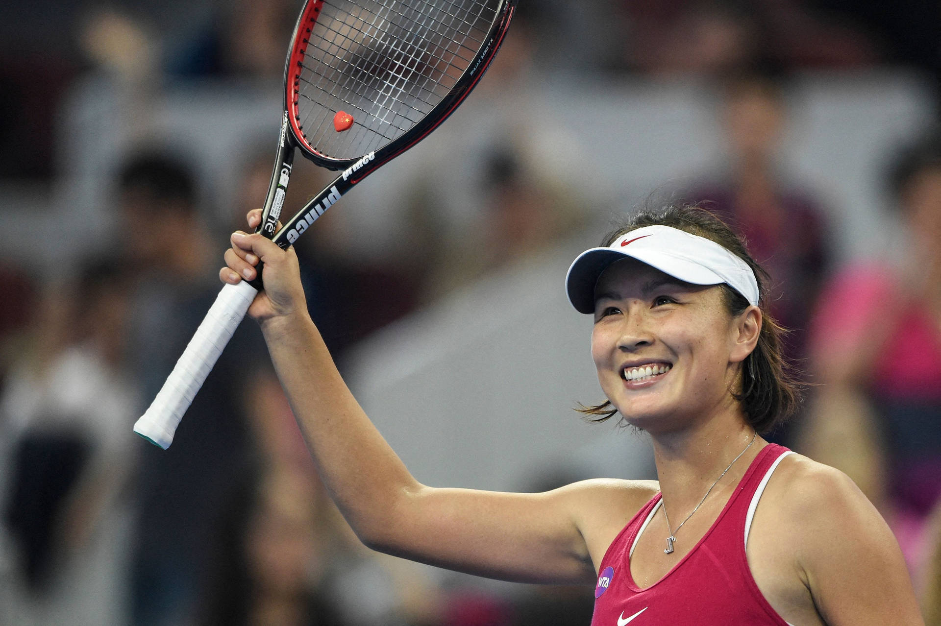 Shuai Peng Raising Her Racket Wallpaper