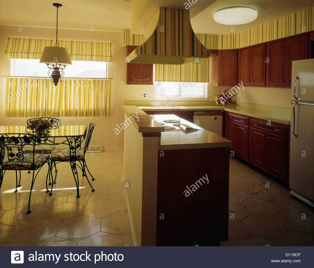 1970s Kitchen And Dining Area With Yellow Striped Curtains