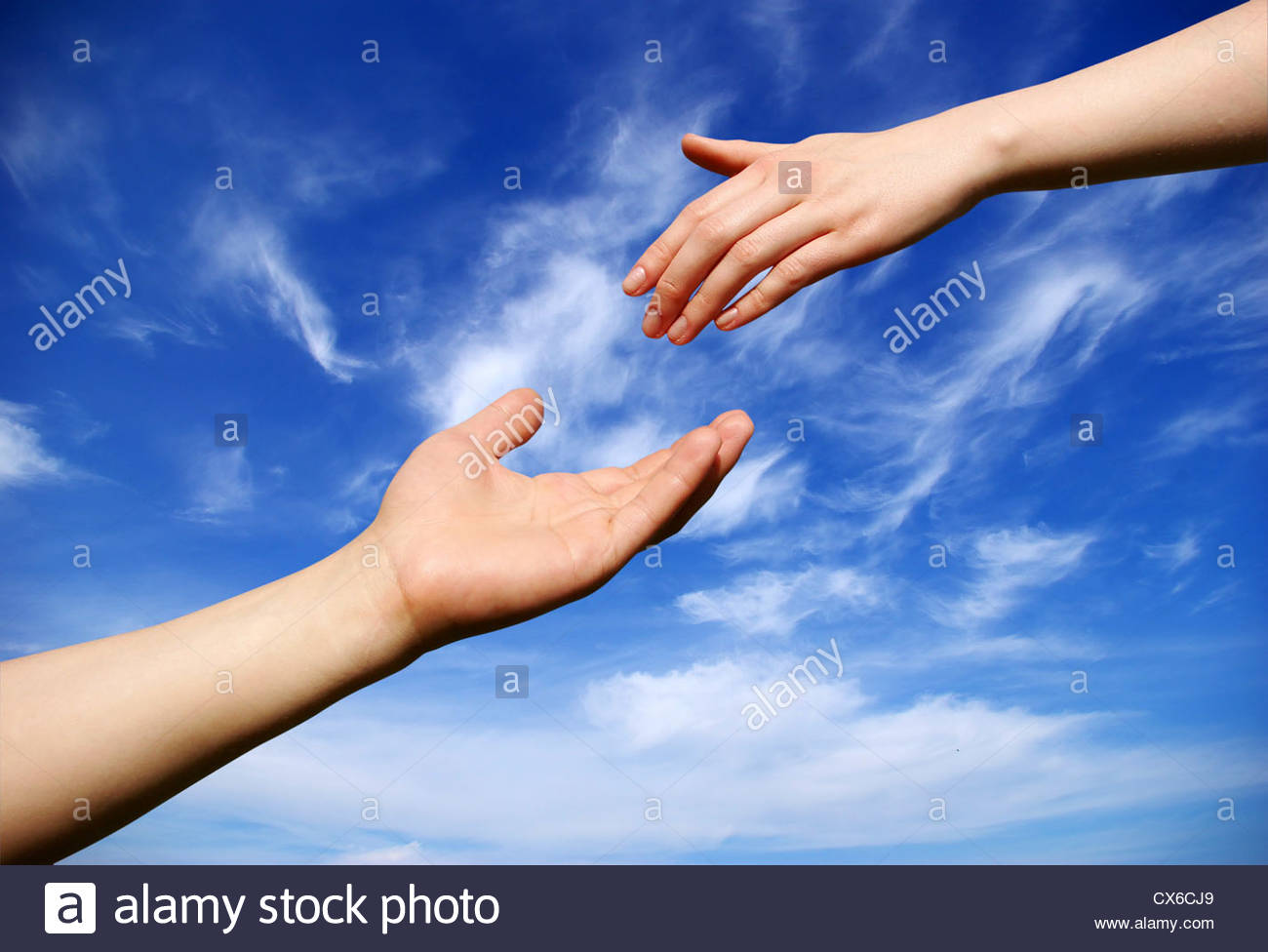 Helping Hand With The Sky Background Stock Photo