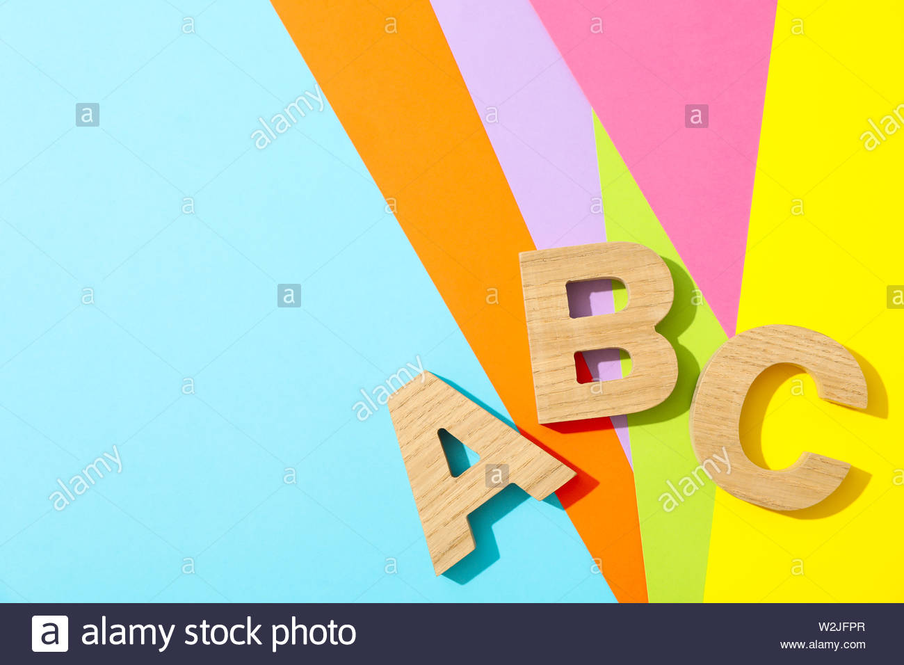 Letters Abc Lined With Wooden On Multicolor Background