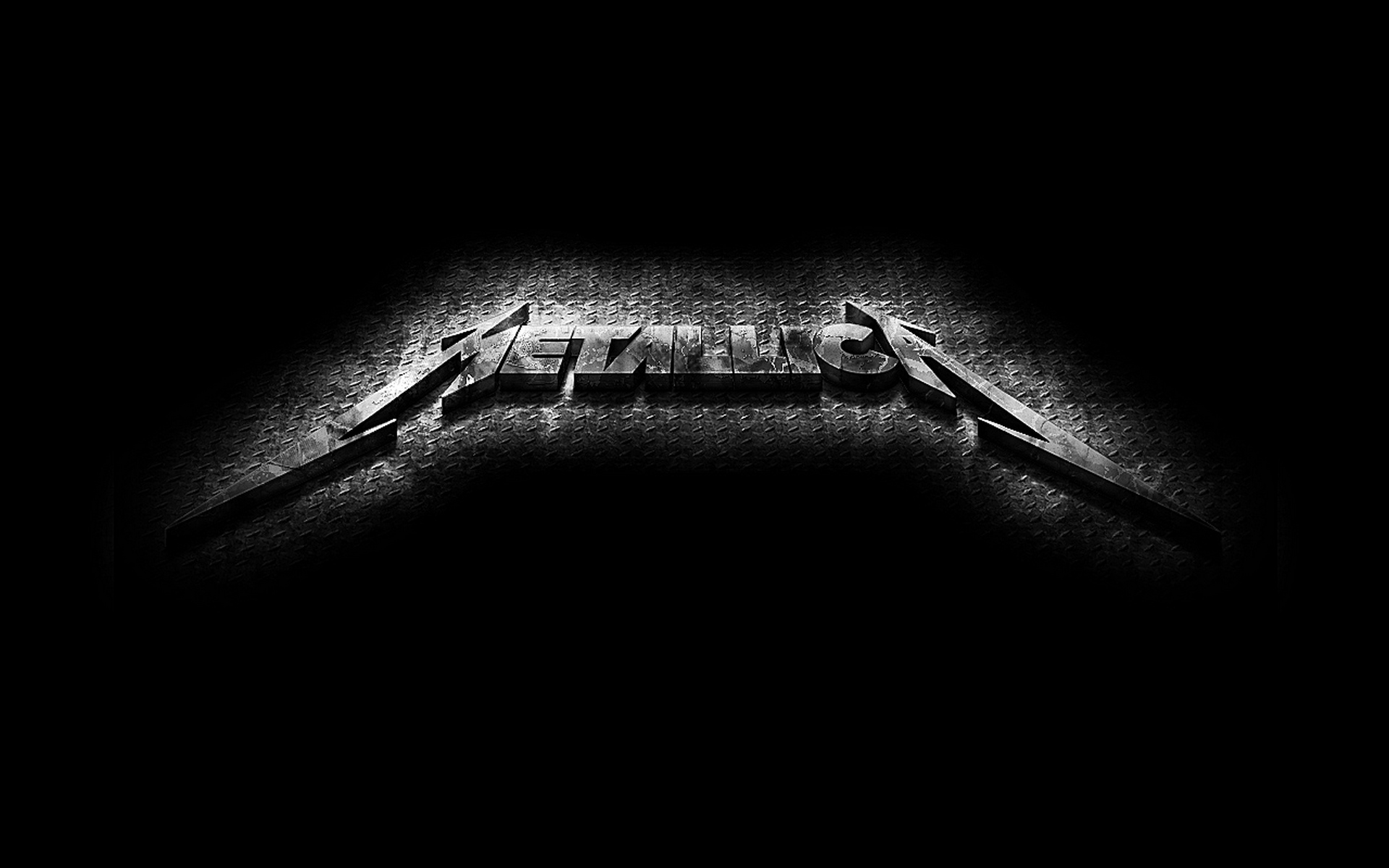 A dark, textured background featuring the Metallica logo in a stylized, metallic font