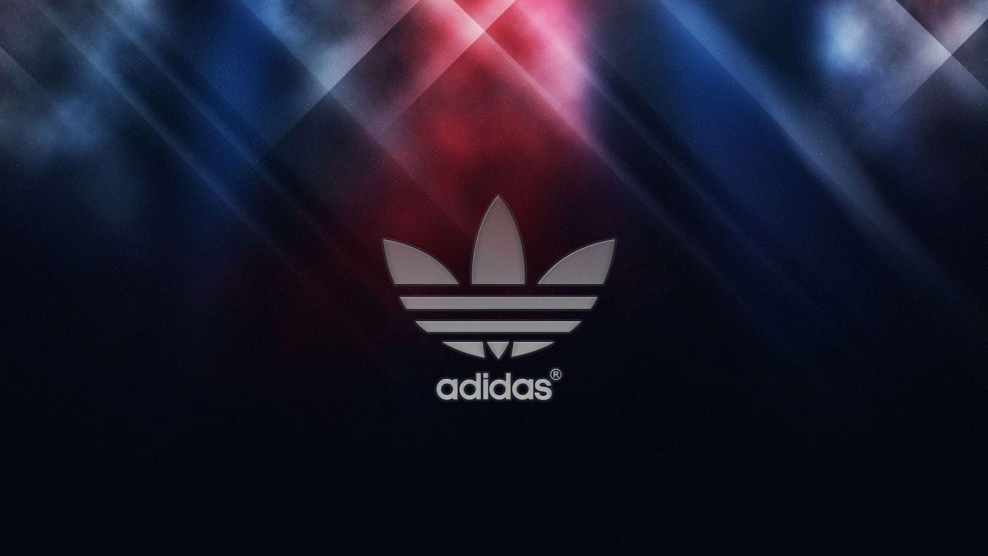 Adidas logo on a dark, abstract background with red and blue lighting effects