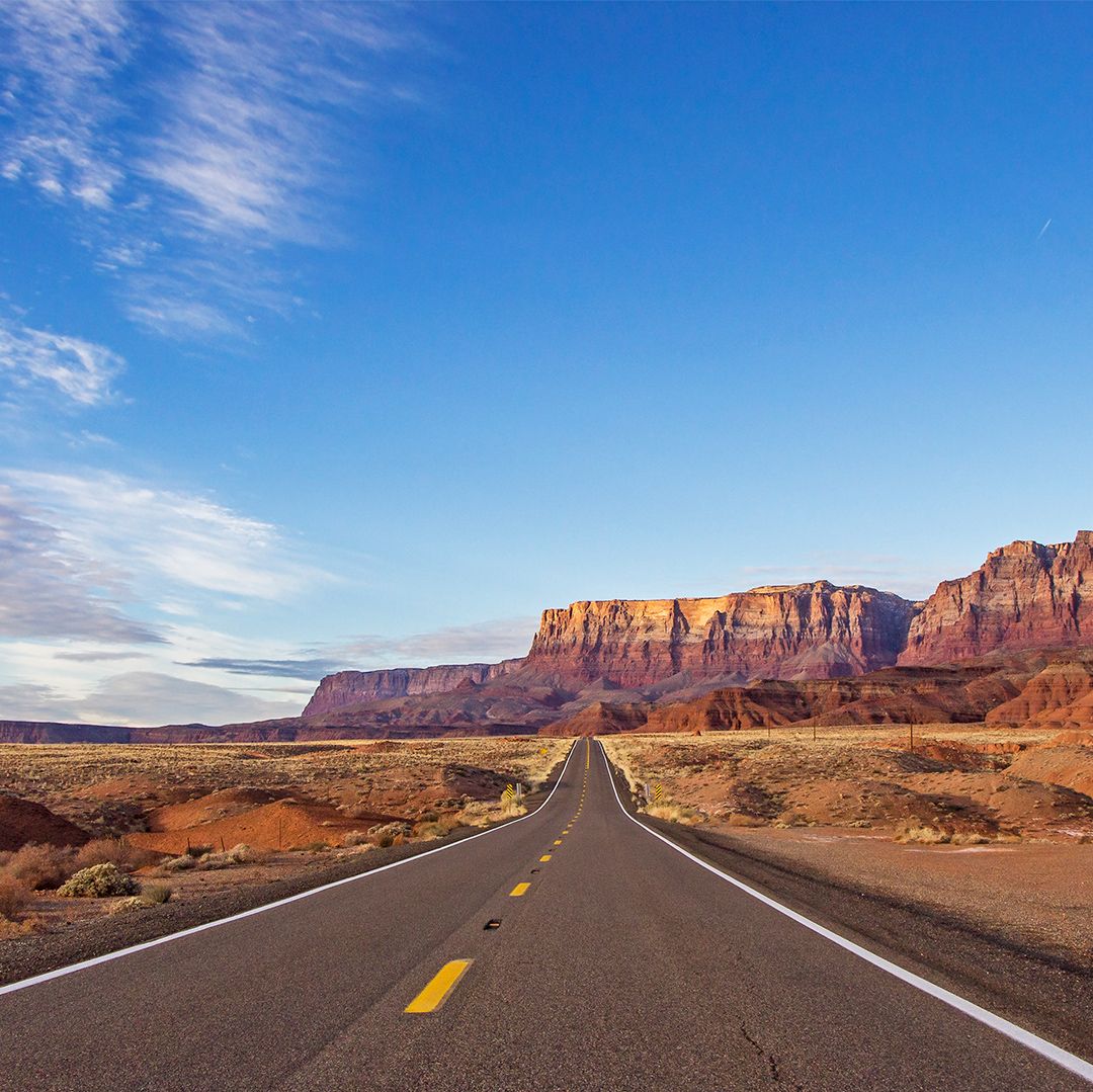 Lonely High Desert Road In Northern Arizona With Vermillion Cliffs