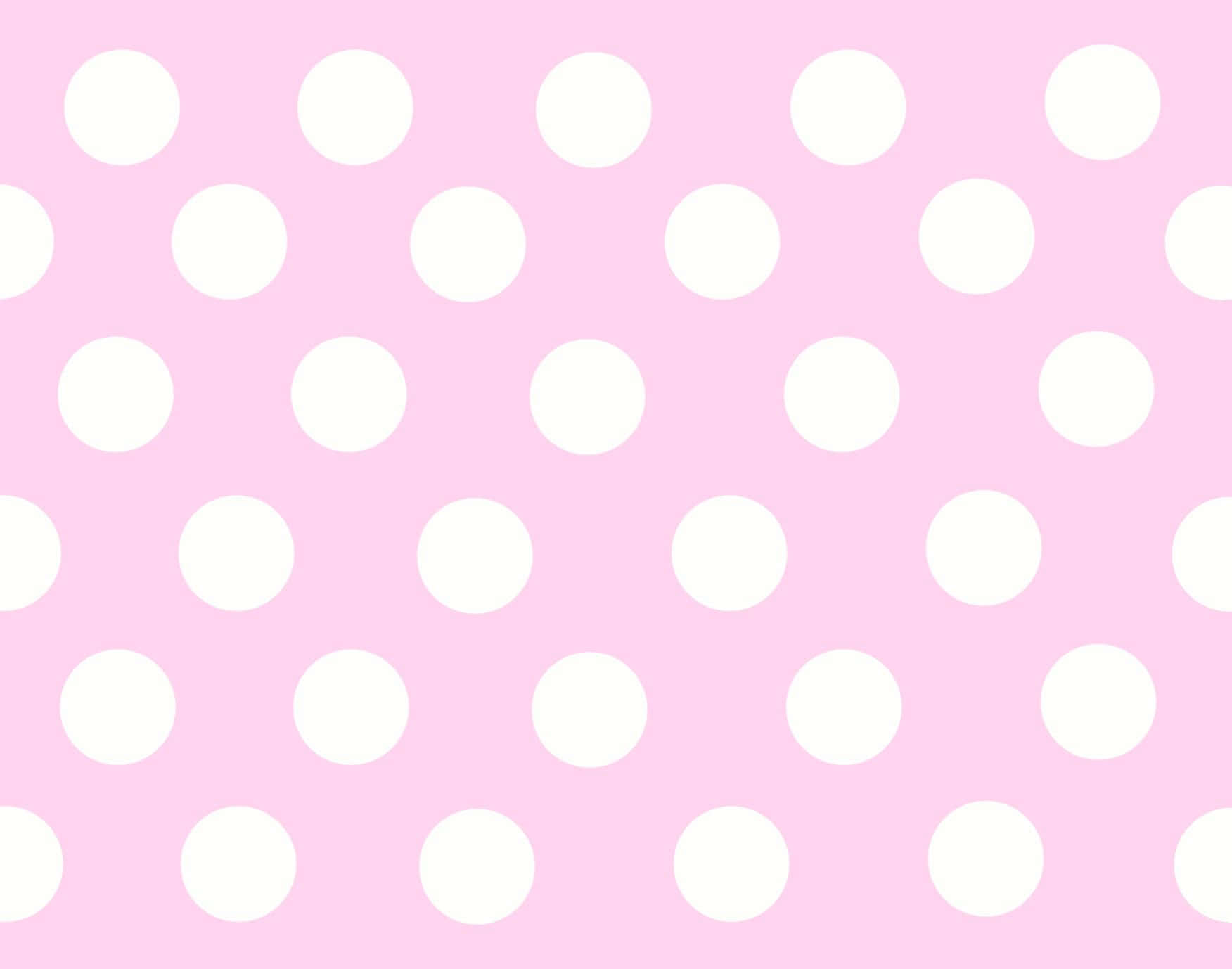A Pink And White Polka Dot Pattern Wallpaper
