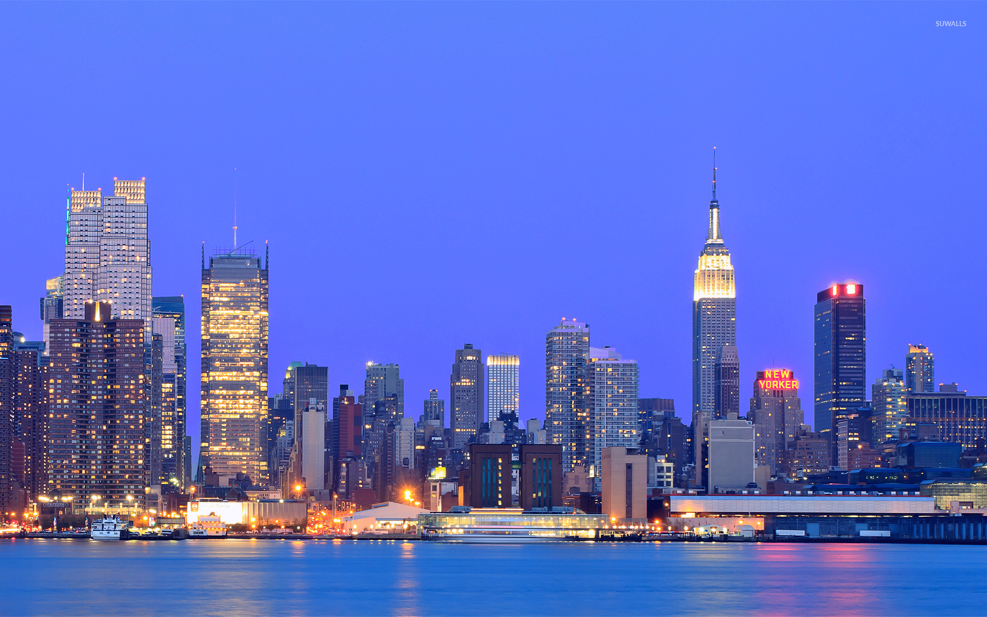 Clear Blue Sky Over New York City At Sunset Wallpaper