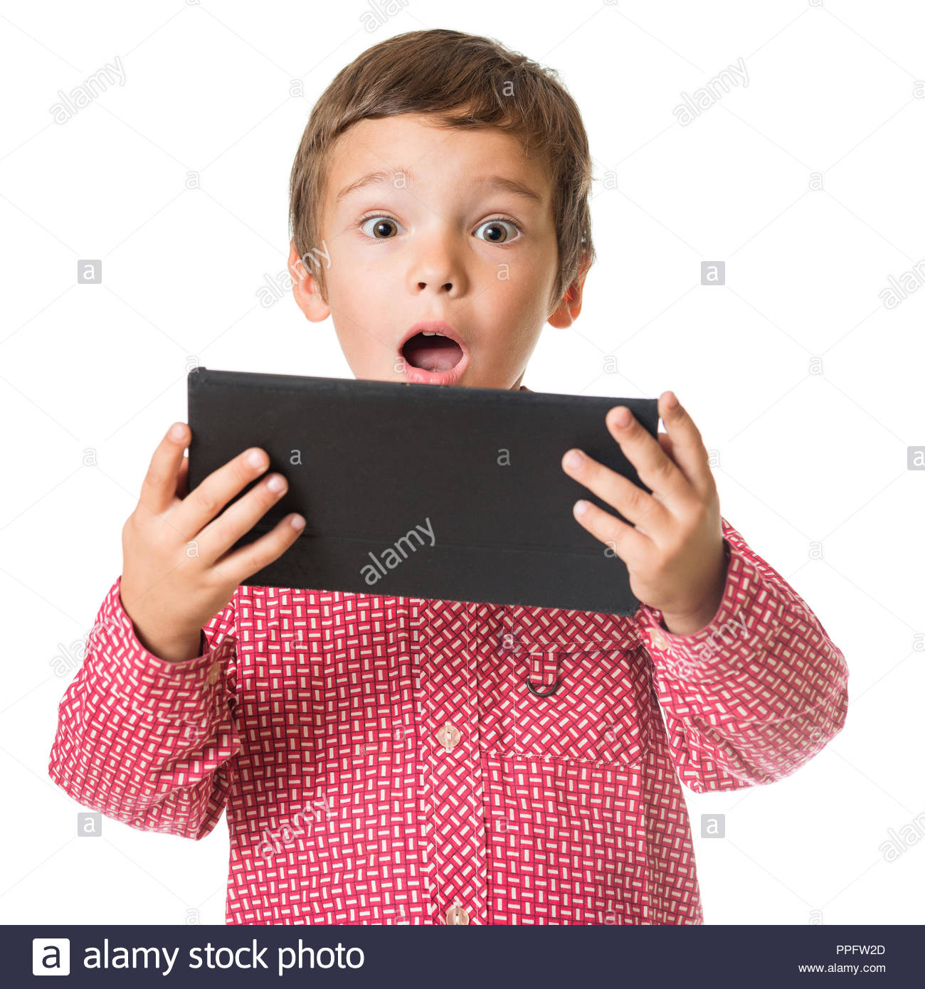 Young Surprised Boy Holding Tablet Isolated On White Background