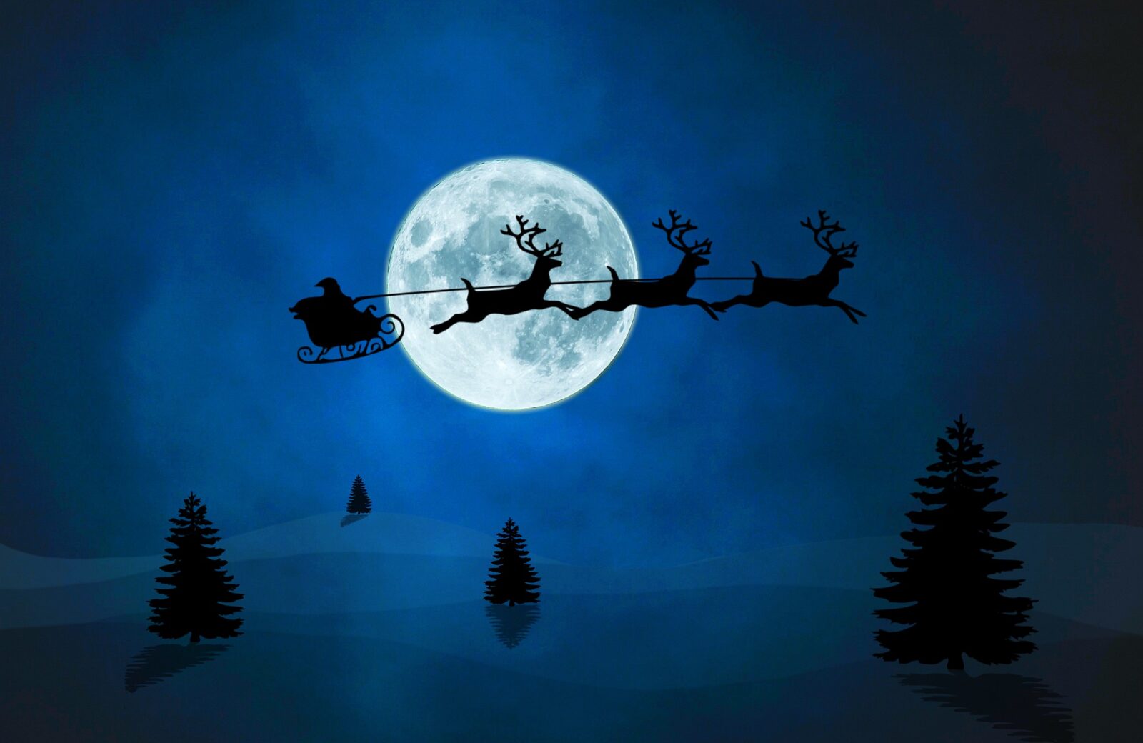 Santa Claus flying his sleigh against a full moon on Christmas Eve