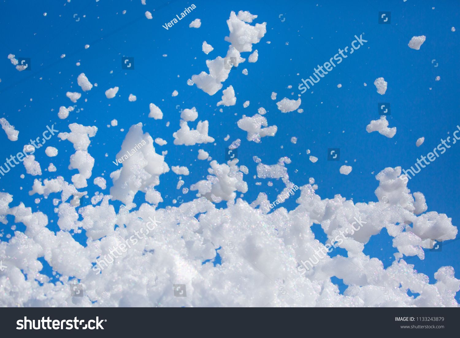 White Soap Foam On A Blue Sky Background Fun Or
