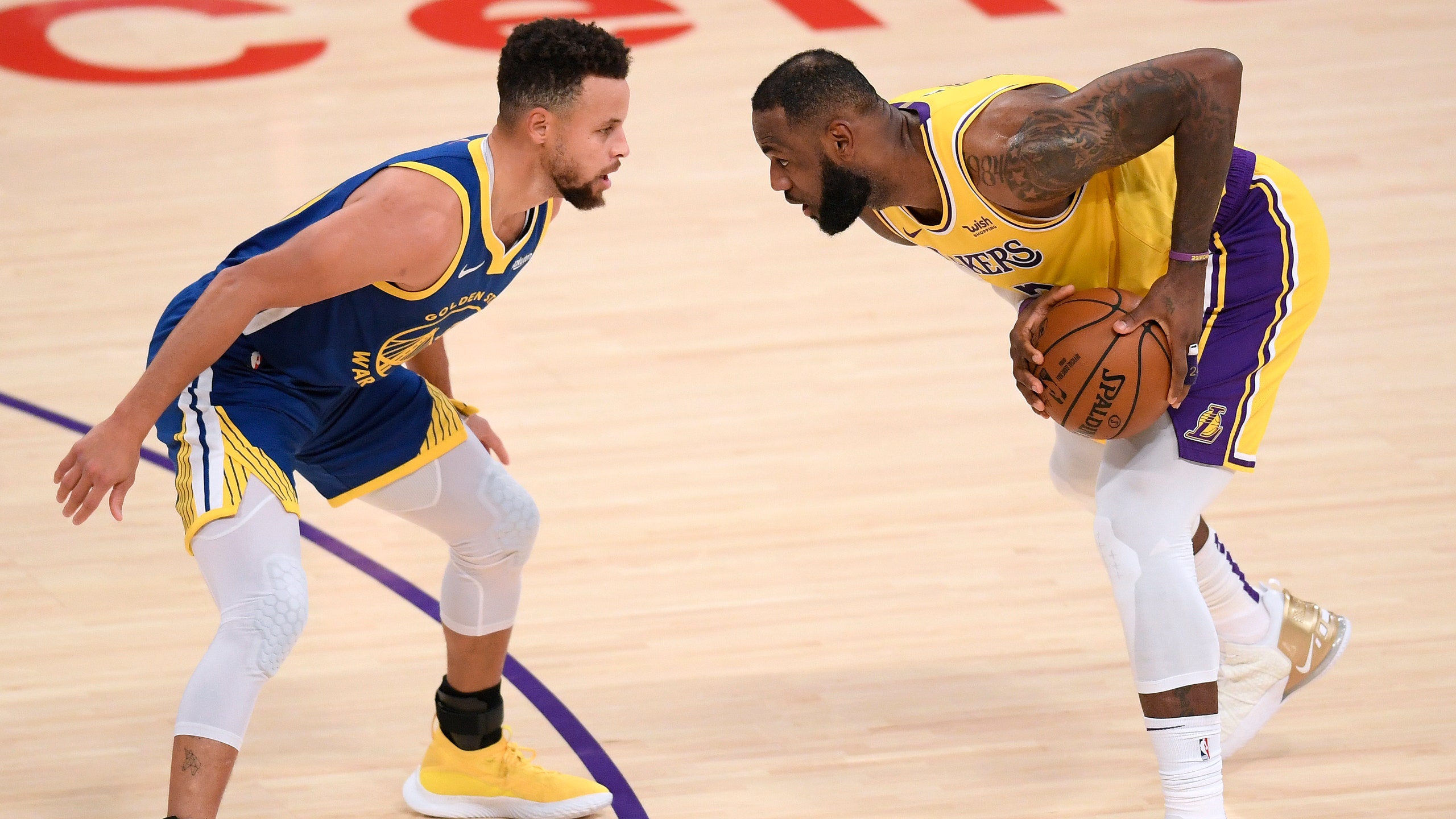 Stephen Curry of the Golden State Warriors and LeBron James of the Los Angeles Lakers face off during an NBA game