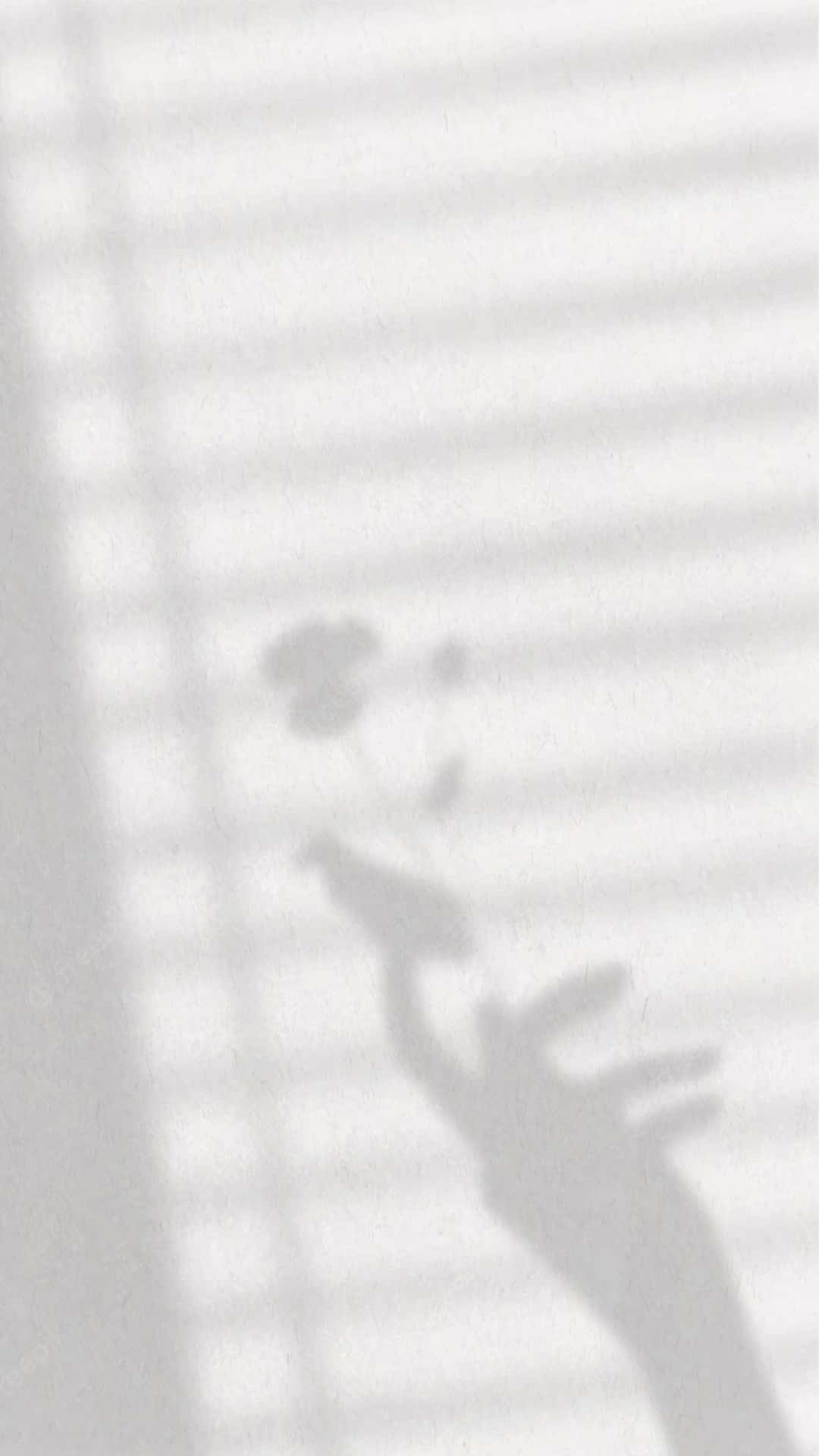 A Shadow Of Hand On White Wall Wallpaper