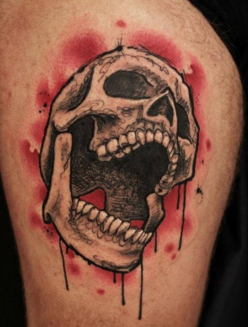 Grey And Black Skull Tattoo On Arm