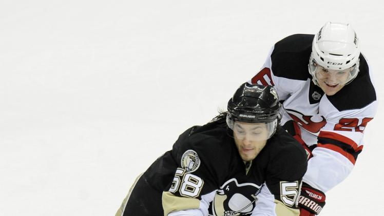 Pittsburgh Penguins Kris Letang Fights For A Loose Puck As New