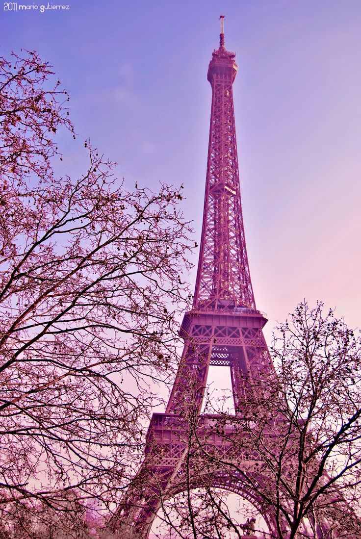 Beautiful hipster girl dressed to impress in a pastel pink ballroom dress  with Eiffel Tower in background Stock Photo - Alamy