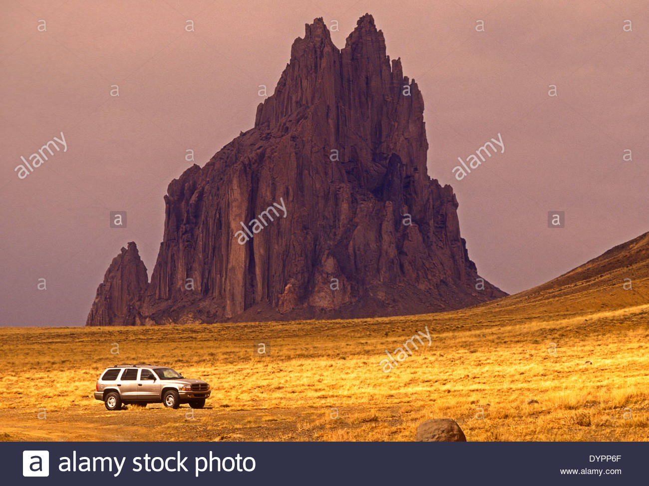 Dodge Durango Ssuv Parked In The Desert With Navajo Ship Rock