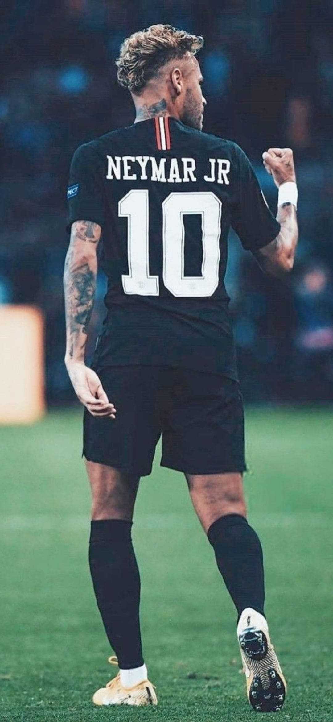 Neymar Jr. celebrating a goal in his PSG kit