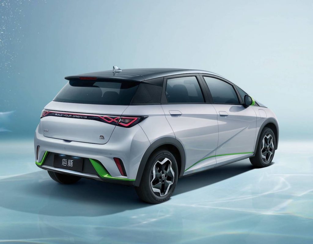A rear view of a silver BYD Seagull electric car, showcasing its compact size, unique design, and green accents