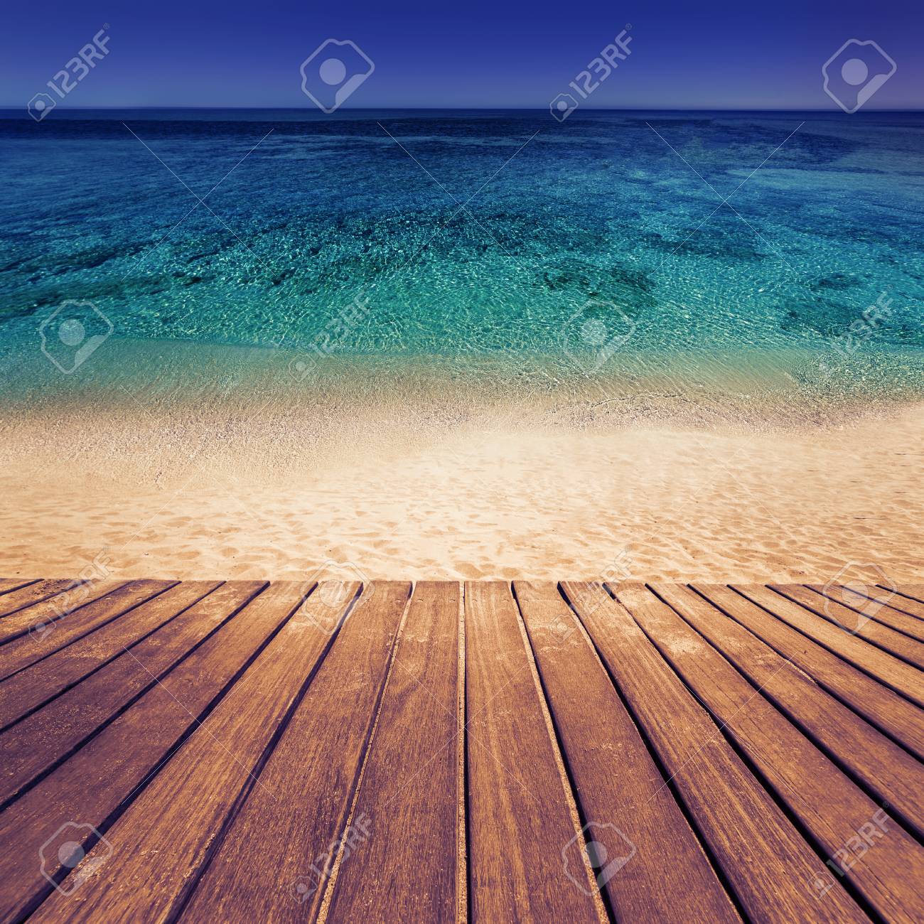 Old Wooden Board In Front Of Beach Sand Background Paradise