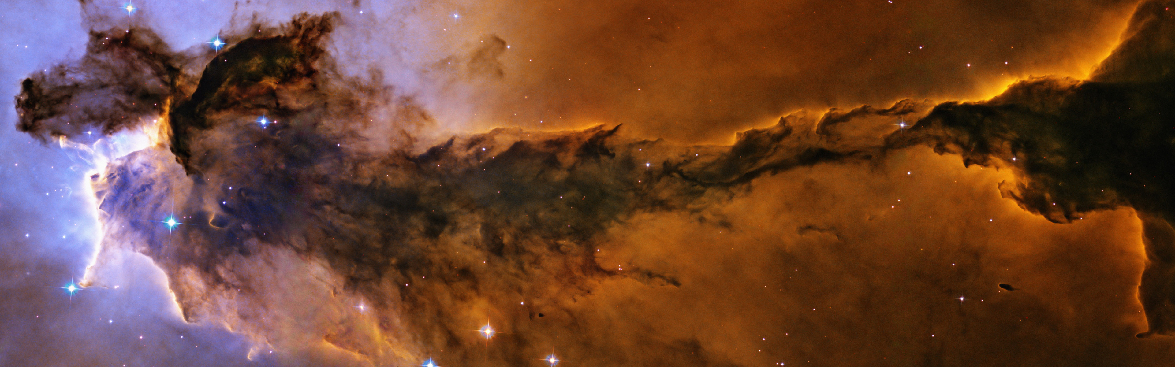 Billowing tower of cold gas and dust rising from the Eagle Nebula