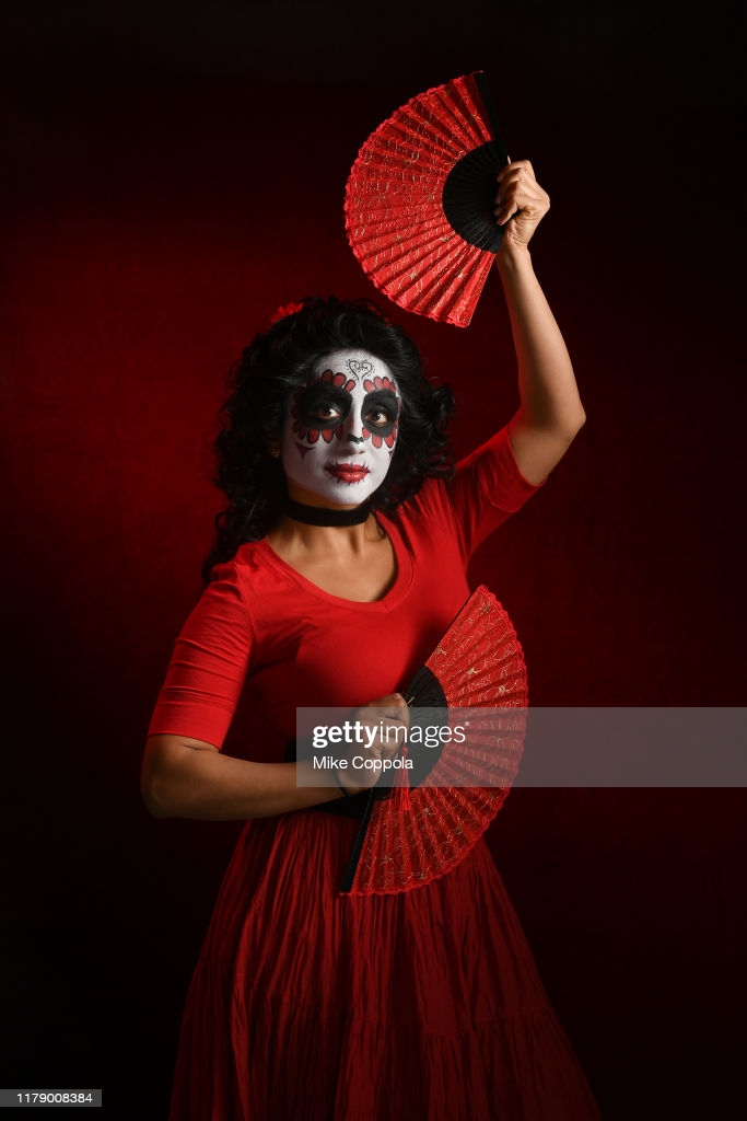 A cosplayer as a Maria Salazar from Deadly Class poses during New