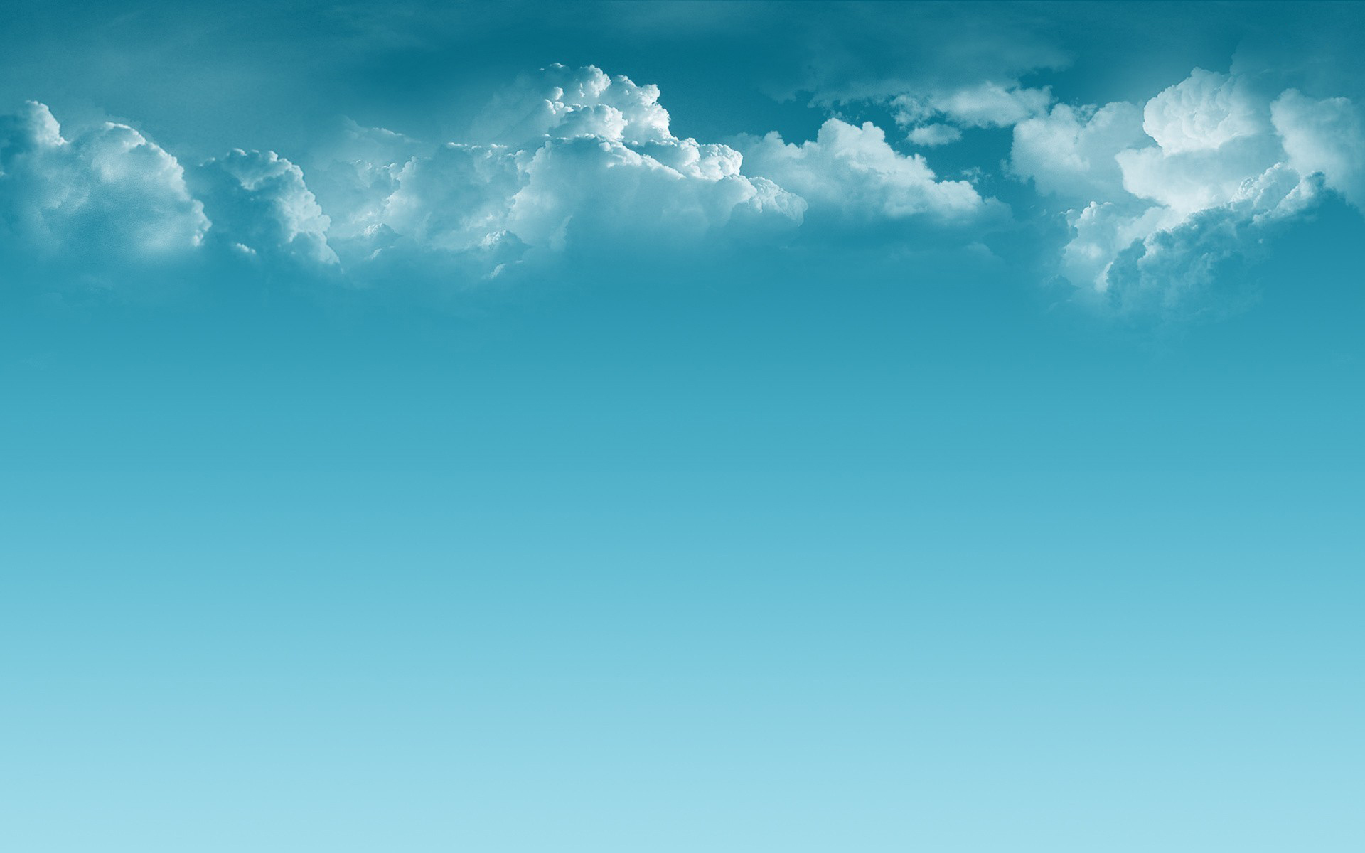 Light blue sky with fluffy white clouds, perfect for a serene background
