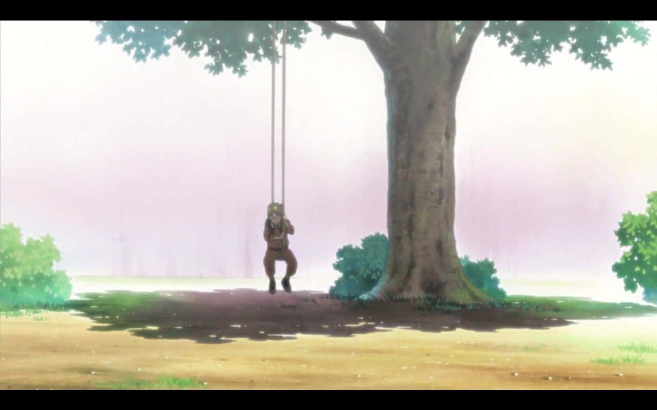 A Girl Is Swinging On Swing In Front Of Tree