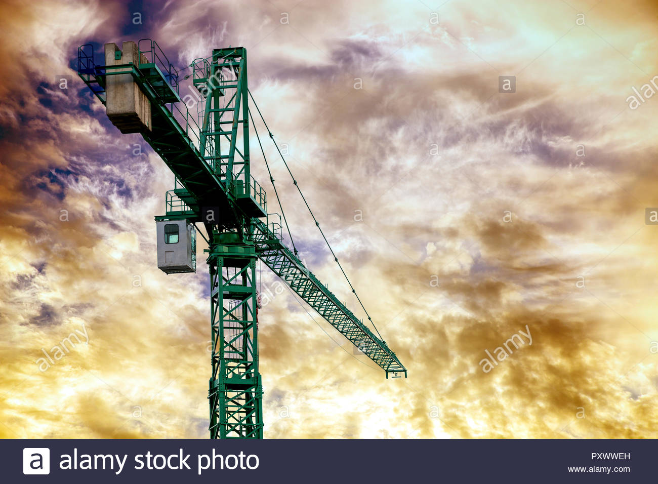 Green Construction Crane At Sunset Background Image With Copy