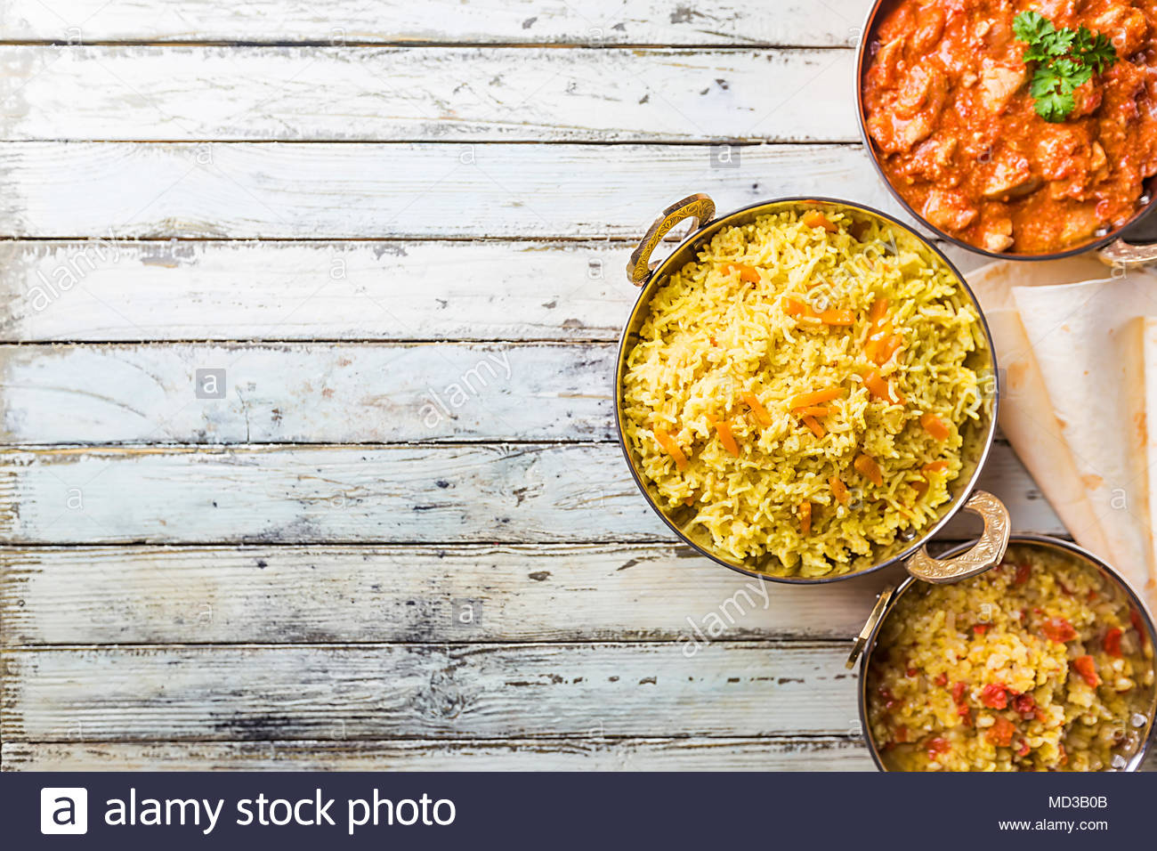 Different Bowls With Assorted Indian Food On White Wooden
