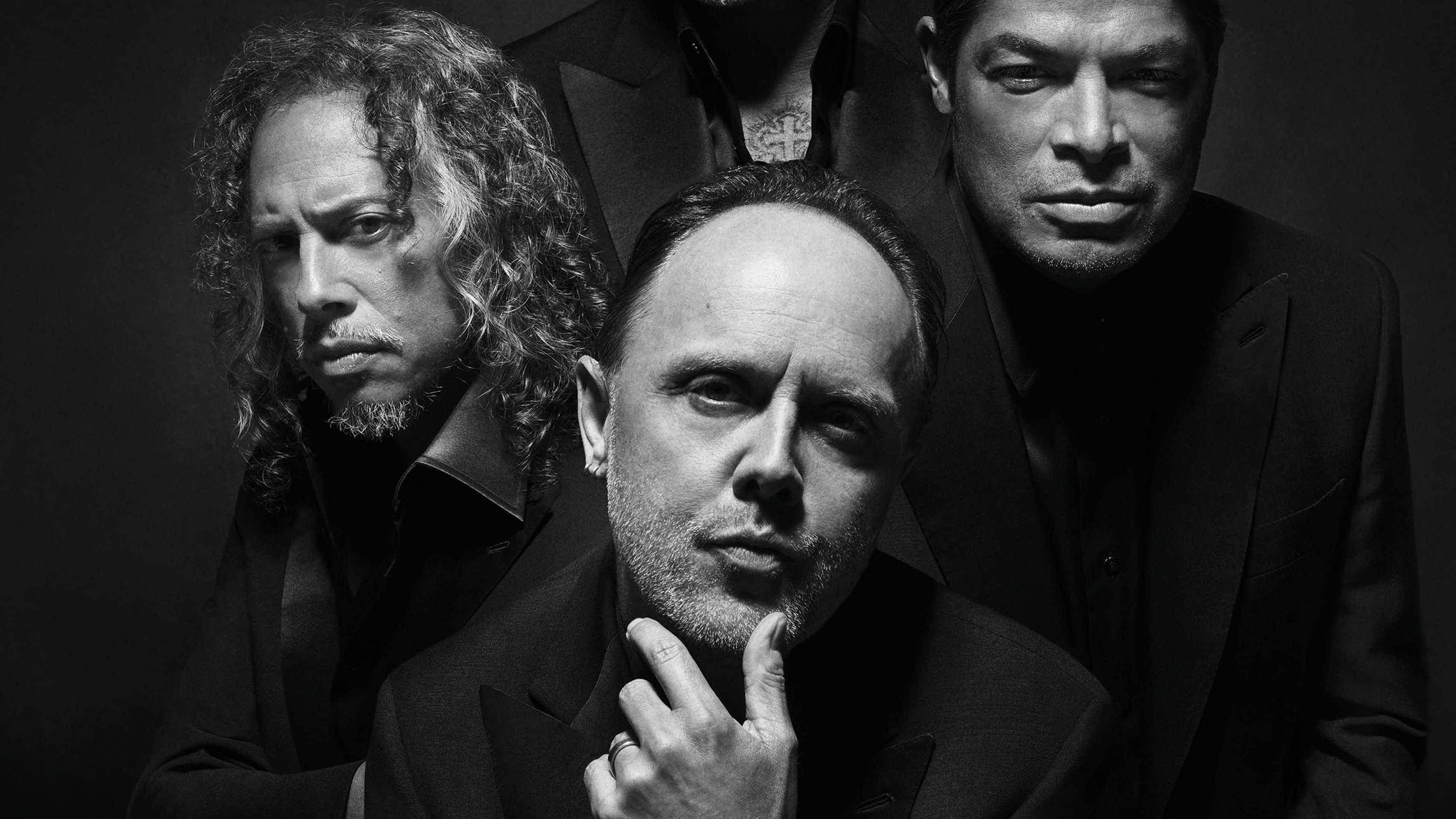 Black and white portrait of Metallica band members James Hetfield, Lars Ulrich, Kirk Hammett, and Robert Trujillo