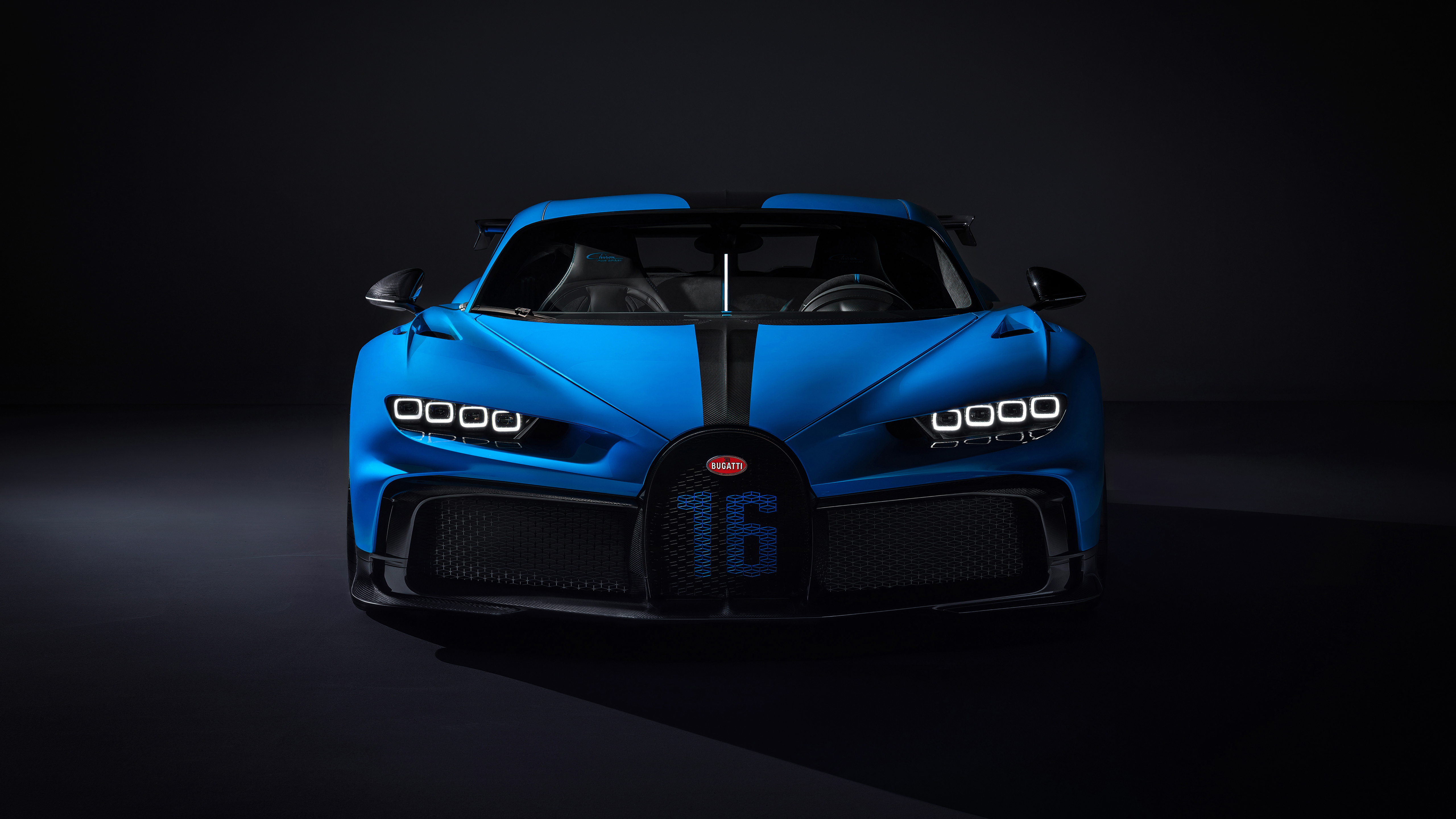 A front view of a blue Bugatti Chiron Pur Sport, highlighting its unique design and racing number 16