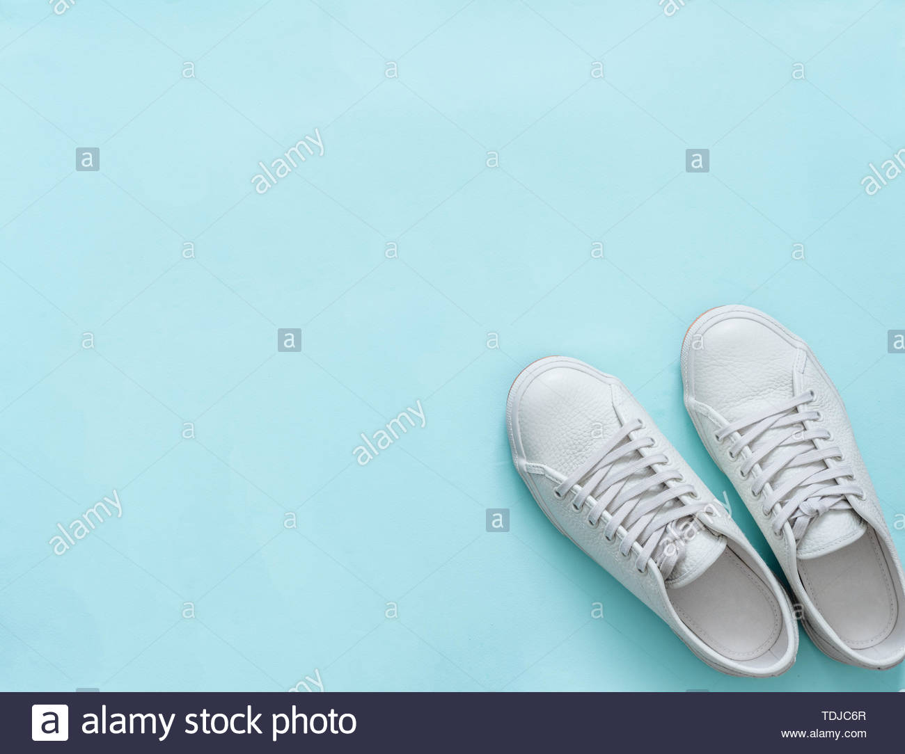 Free download White leather sneakers on blue background Pair of fashion ...