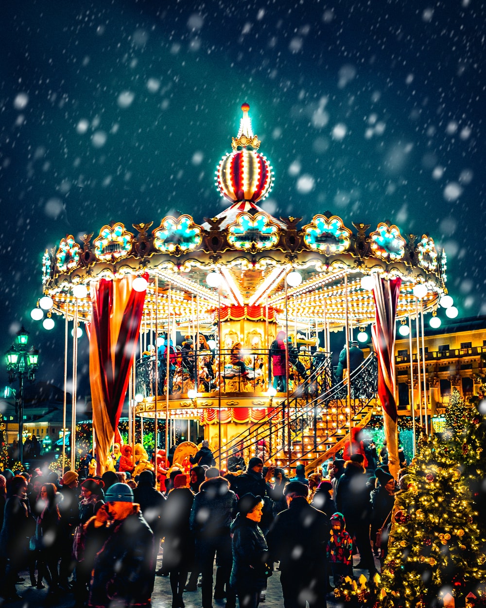 Carousel With Snow Pouring Down Photo Person Image