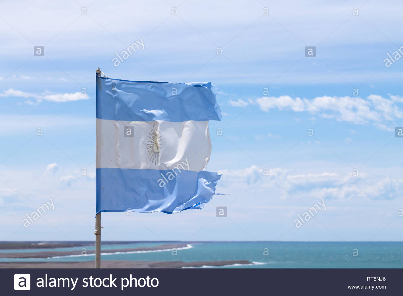 Argentina Flag With Atlantic Ocean In Background
