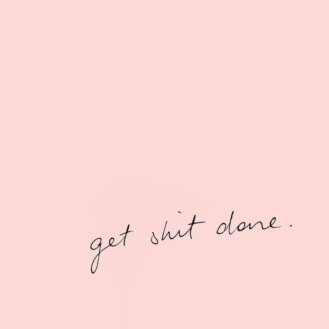 A motivational quote on a pink background that says 
