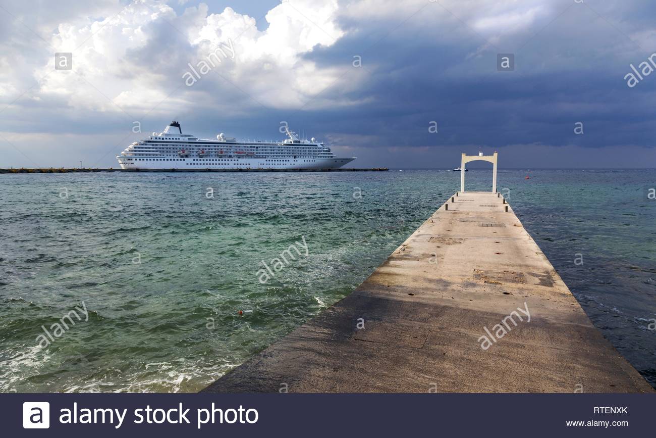 Large Cruise Ship Liner And Stone Pier Against The Background Of