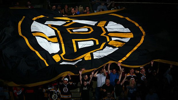 Boston Bruins Fans Hold A Giant Flag With The Logo On It Prior